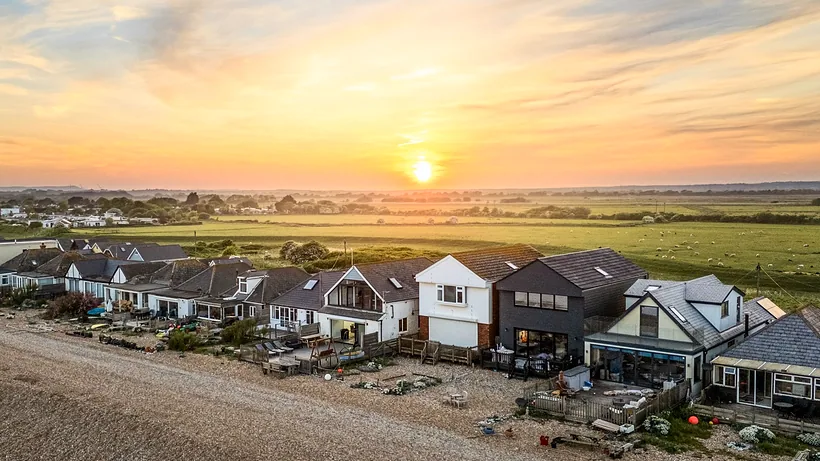 Seafront homes at sunset, drone property photography London