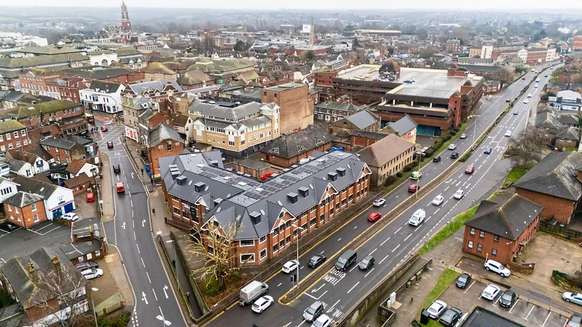 Drone along high street to new development, drone property photography London