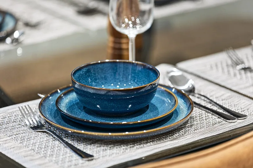 Blue stoneware place setting detail, Airbnb photography London