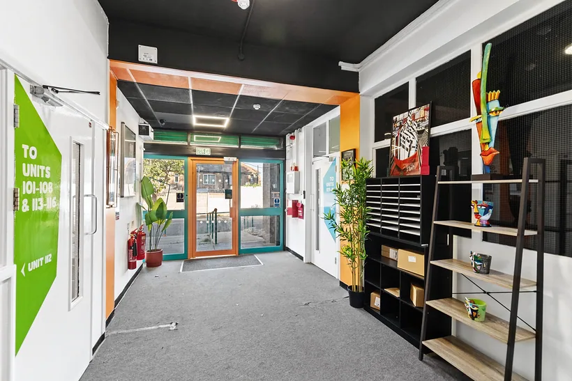 Bright entrance corridor leading to studio units, commercial photography London