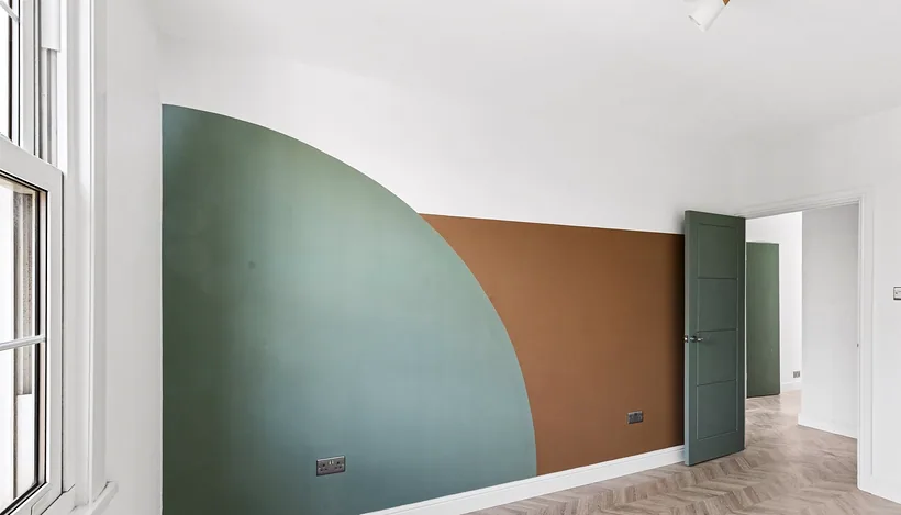 Green and terracotta arch wall, bright HMO refurb, developer photography London