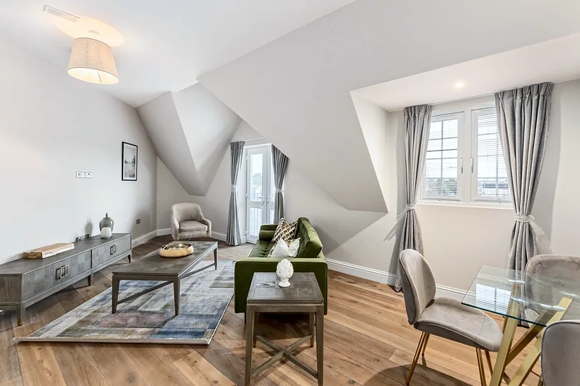 Loft living with dressed curtains, eaves, developer photography London