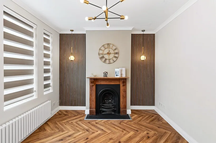 Herringbone floor, fireplace and brass light, developer photography London