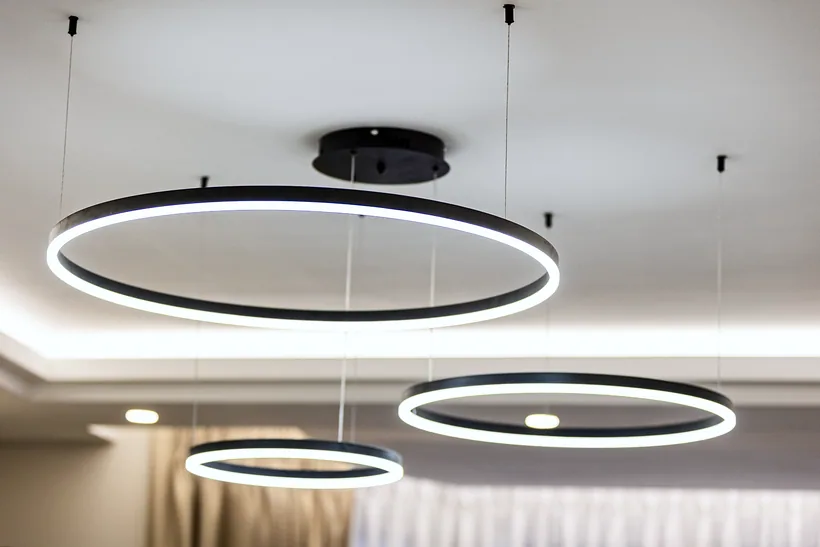 Ring pendant lights in a living space, interior photography London