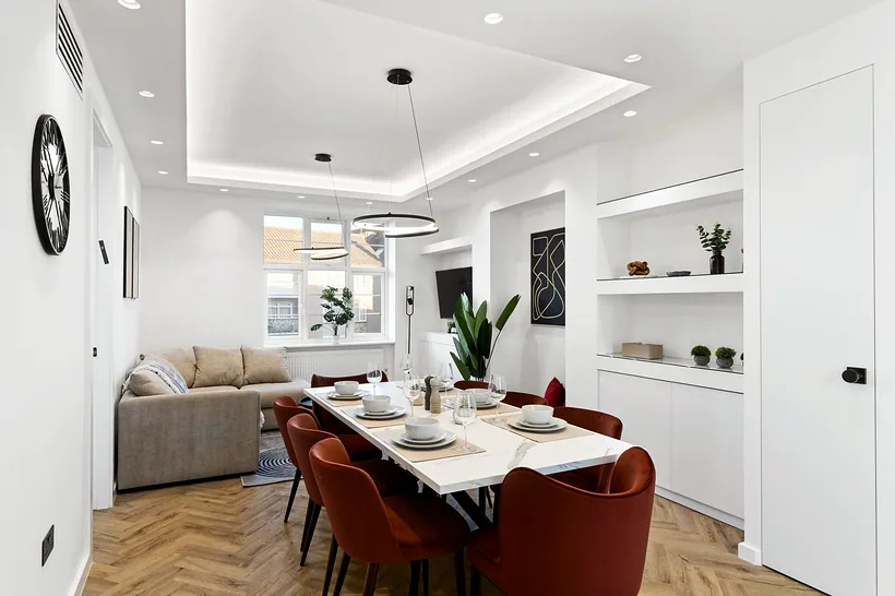 Set dining under ring chandelier, interior photography London