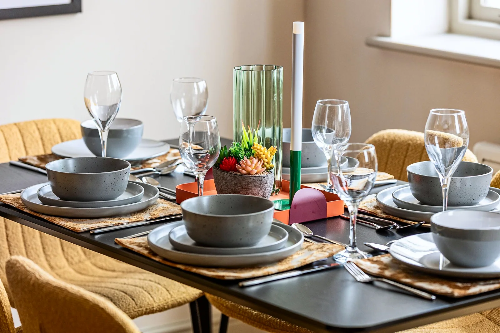 Styled dining table close-up with candles, interior photography London