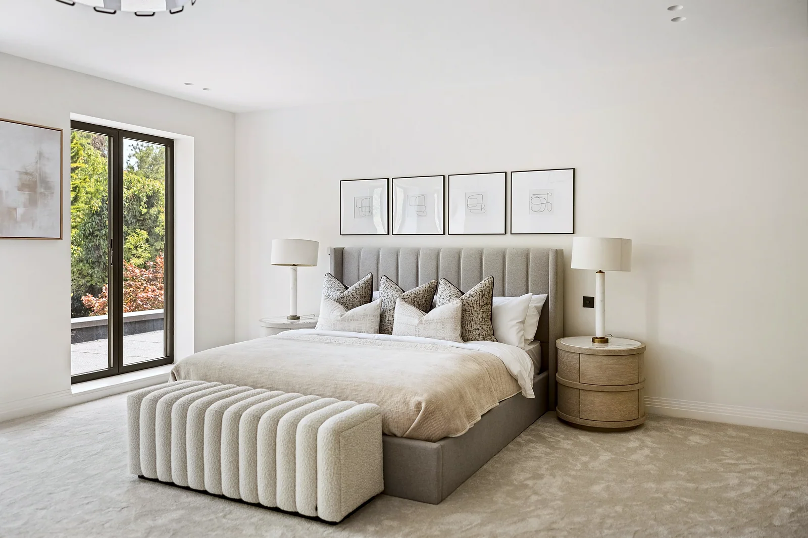 Calm neutral master bedroom, symmetrical styling, interior photography London