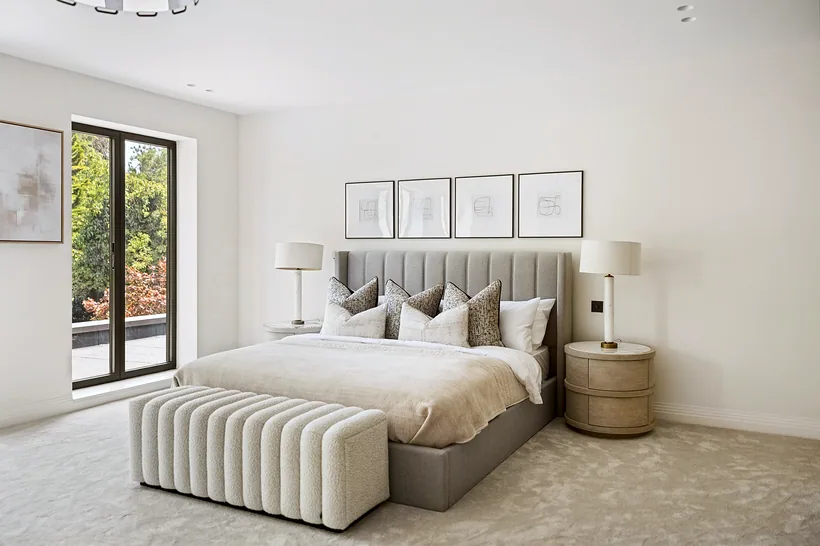 Calm neutral master bedroom, symmetrical styling, interior photography London
