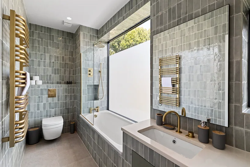 Bathroom with sage handmade tiles and brass fittings, kitchen photography London