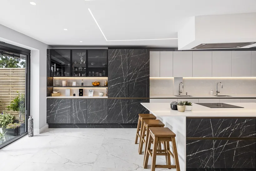 Kitchen with dark stone feature wall, kitchen photography London