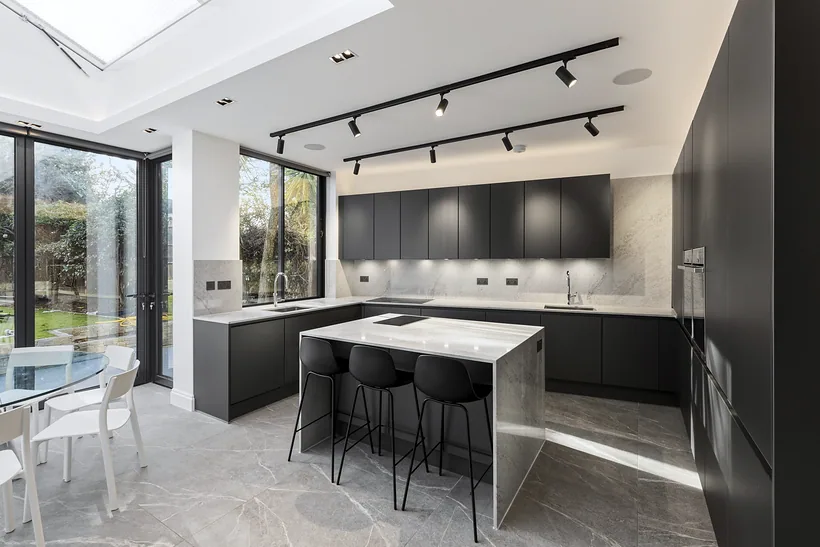 Grey kitchen with a marble island, kitchen photography London