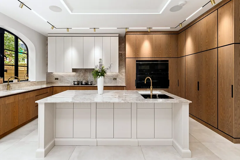 Kitchen island with walnut cabinetry, kitchen photography London