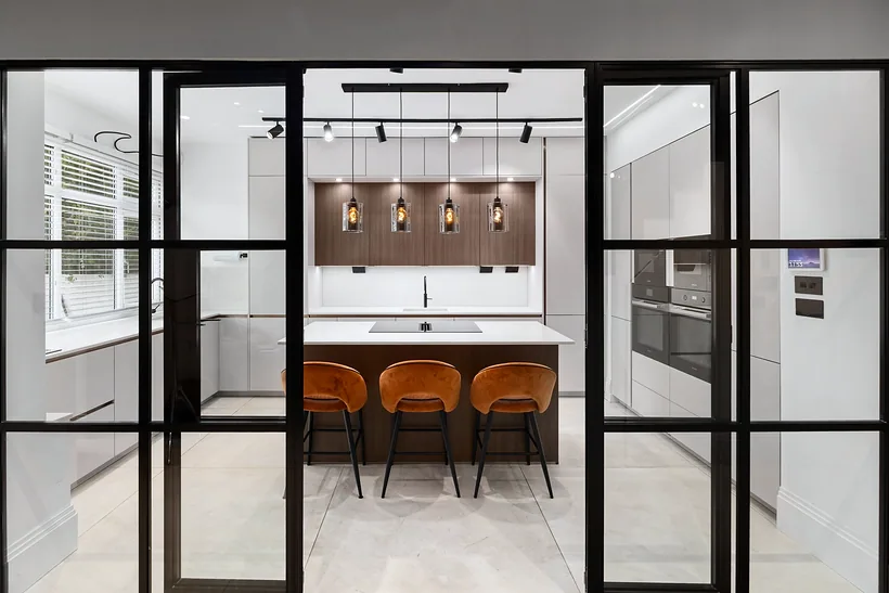 Kitchen behind black steel glazed doors, kitchen photography London