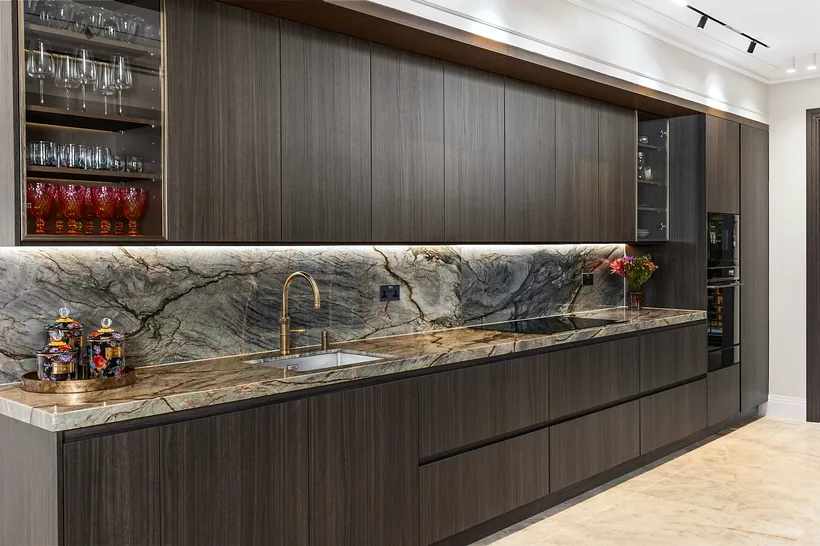 Dark wood and quartzite splashback run, kitchen photography London