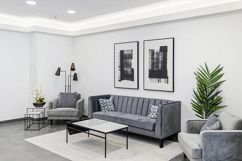Neutral show-flat living room with grey sofas, interior photography London