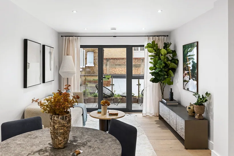 Styled living room opening to a patio, estate agent photography London