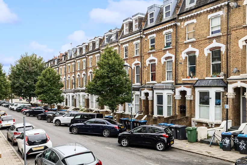 Red-brick Victorian terrace street in sun, estate agent photography London