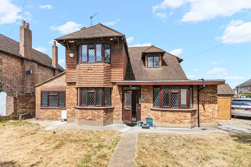 Arts & Crafts detached house under dramatic sky, estate agent photography London