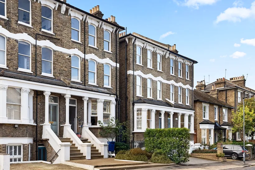 Victorian terrace street exterior, crisp blue sky, estate agent photography London