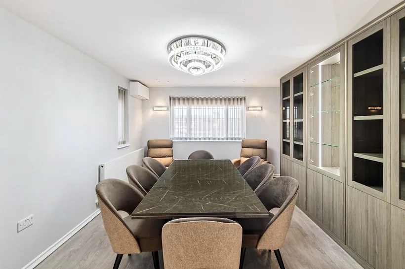 Dining room with crystal chandelier and display cabinetry, estate agent photography London
