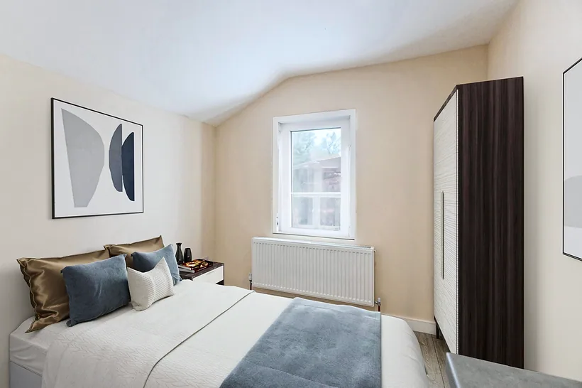 Dressed bedroom with art and grey bedding, estate agent photography London